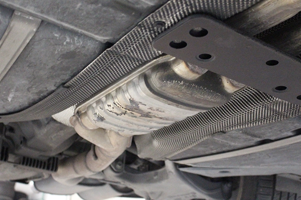 Catalytic converter on underside of vehicle 